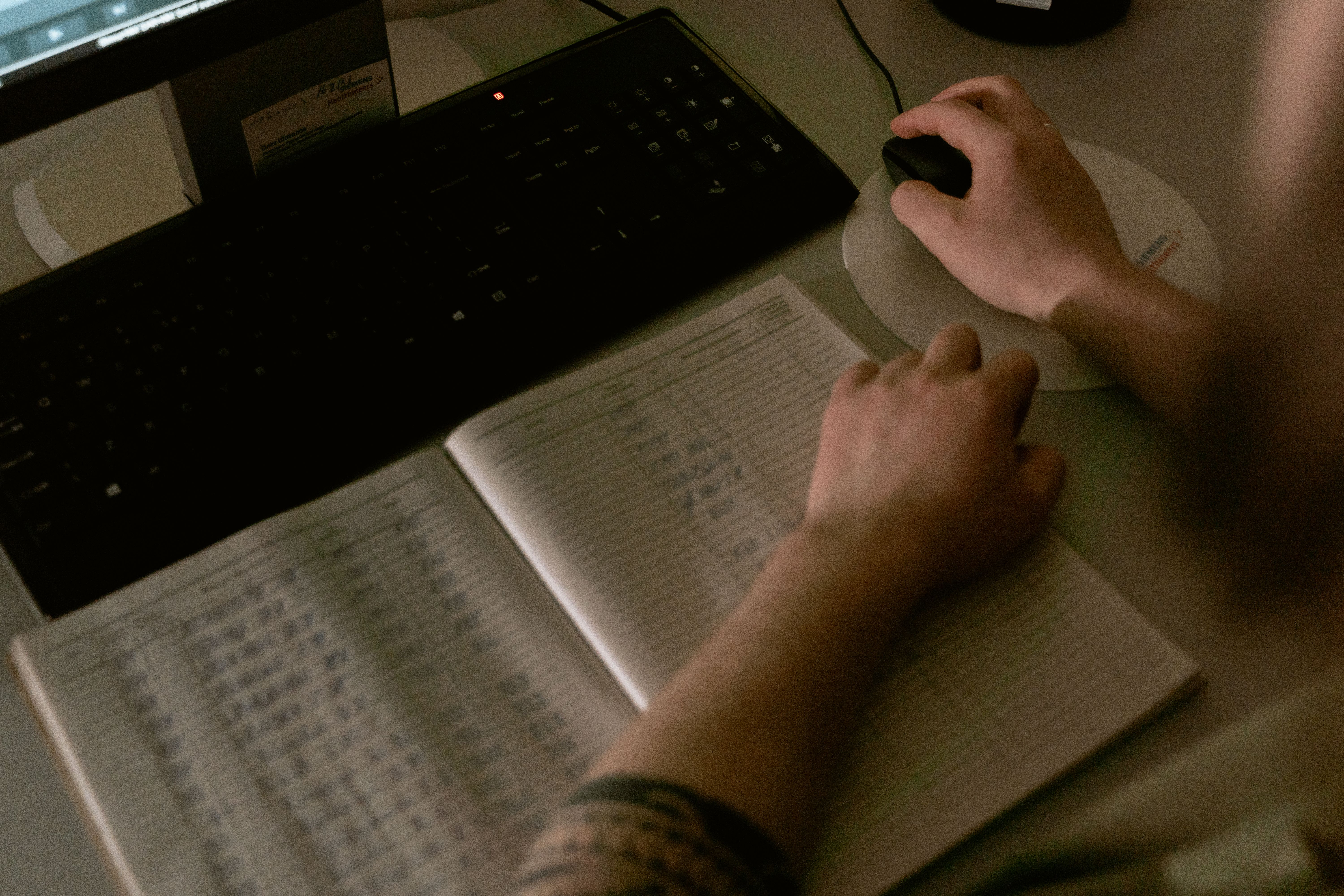 Healthcare professional reviewing digital medical records