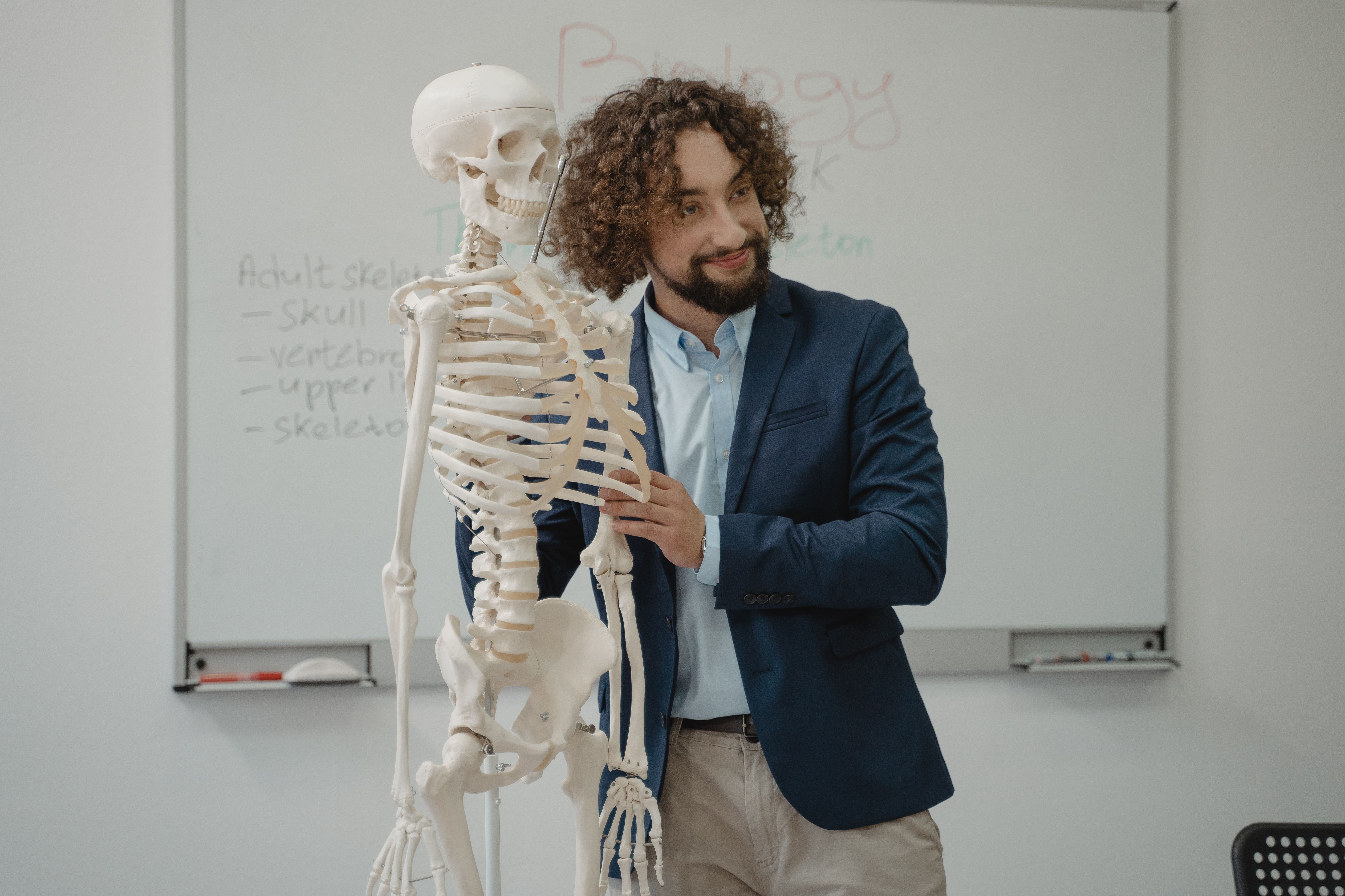 Instructor teaching medical anatomy in a classroom