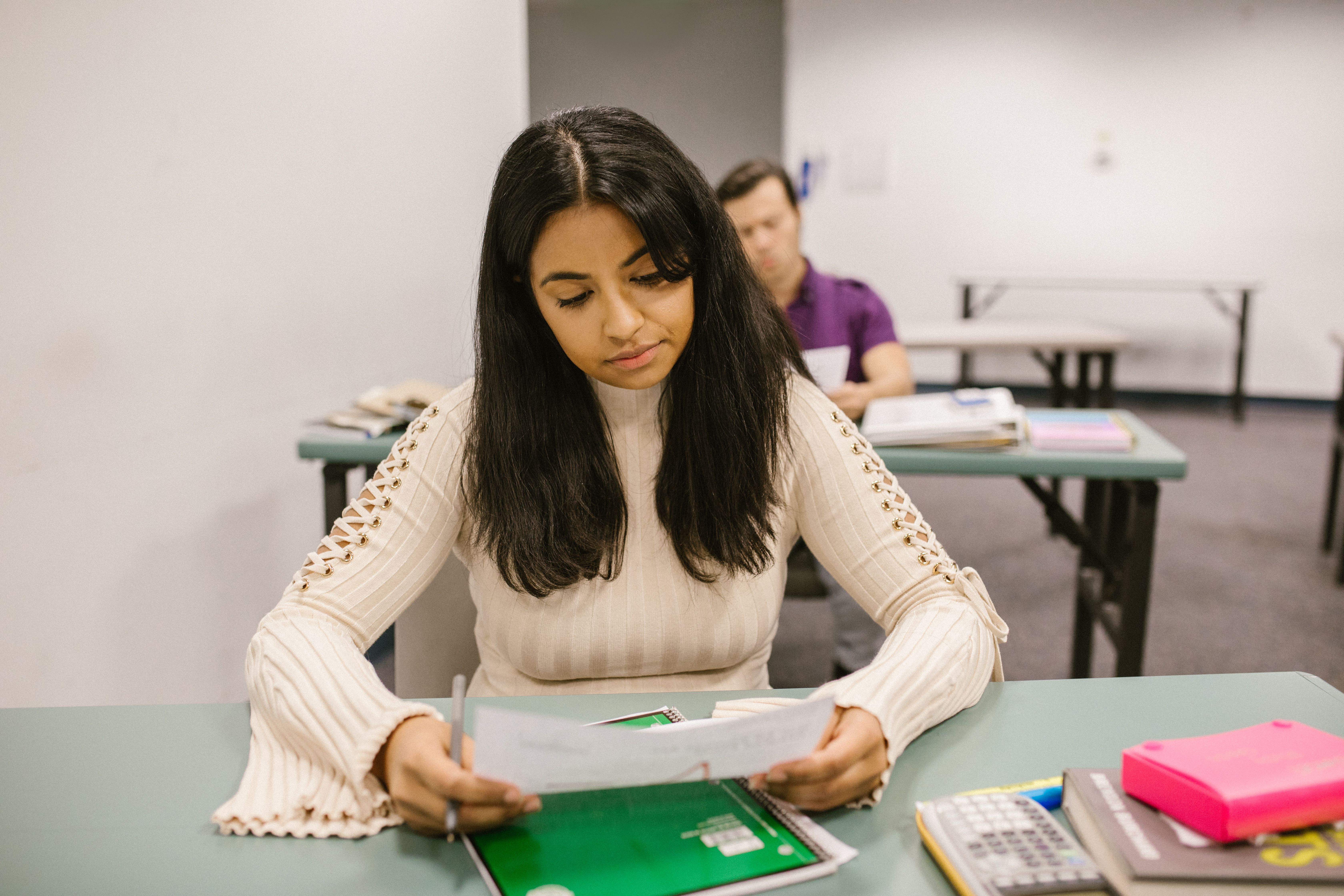 Student reviewing test results and exam materials